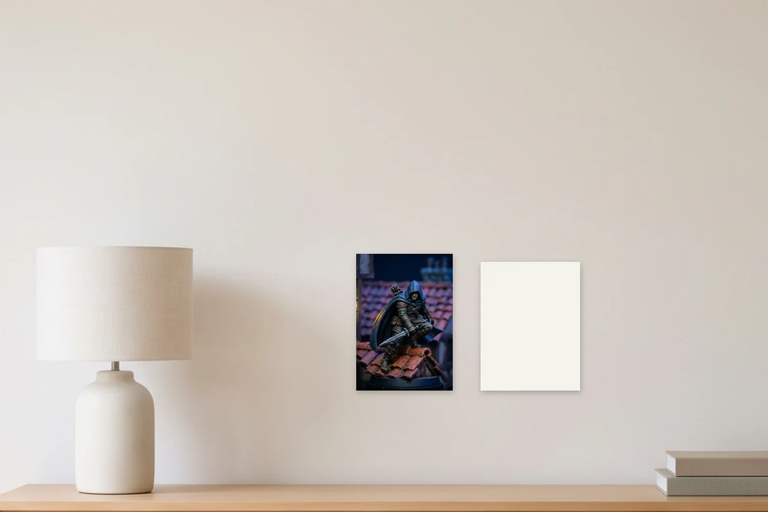 An A4 art print, 8.3 × 11.7 in, beside a blank US Letter sheet, 8.5 × 11 in, on a wall above a sideboard, shown to scale with example artwork