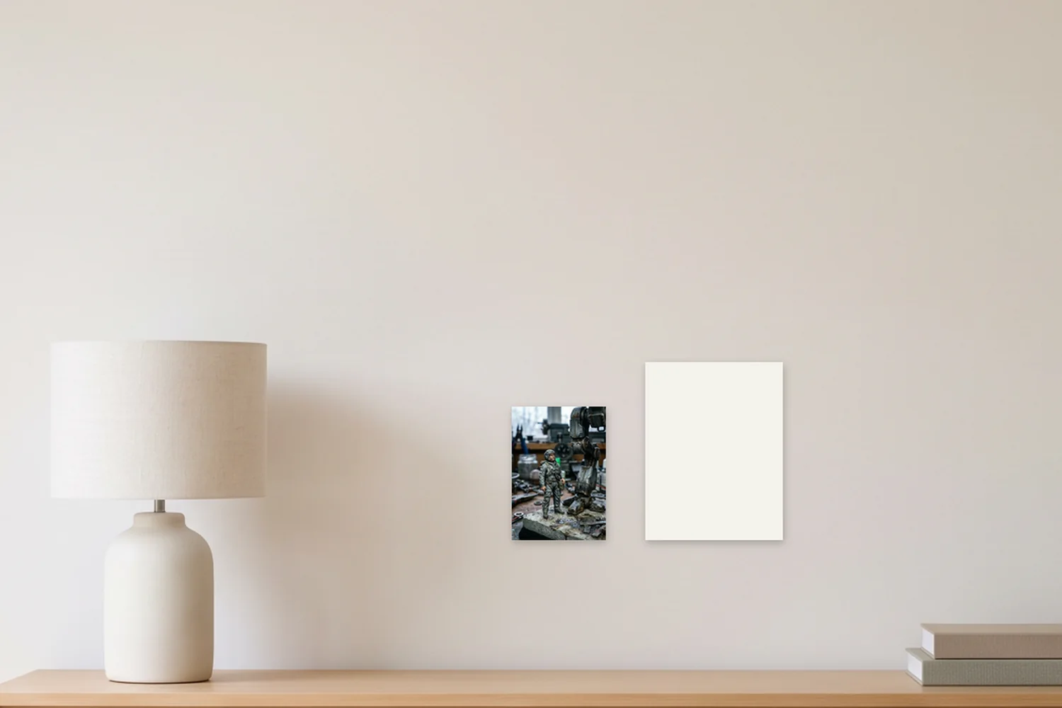 An A5 art print, 5.8 × 8.3 in, beside a blank US Letter sheet, 8.5 × 11 in, on a wall above a sideboard, shown to scale with example artwork
